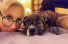 Sabian Symbol for Sagittarius 21: A child and dog with borrowed glasses.